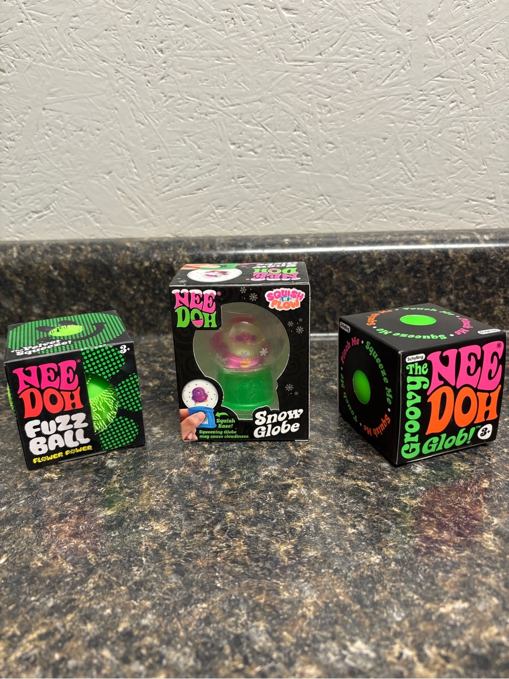 NeeDoh Lot. Rare Santa Snowglobe, Green Fuzzball, and Green Glob